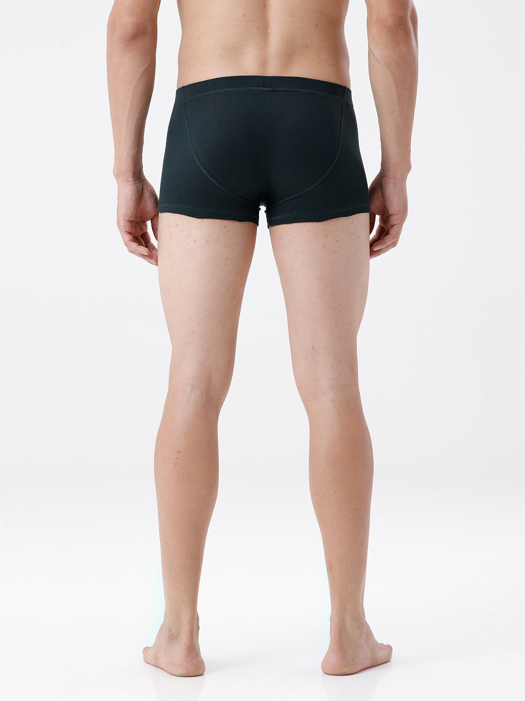 Person wearing black boxer briefs on a white background