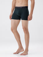 Person wearing black boxer briefs with 'Crocodile' branding on a white background