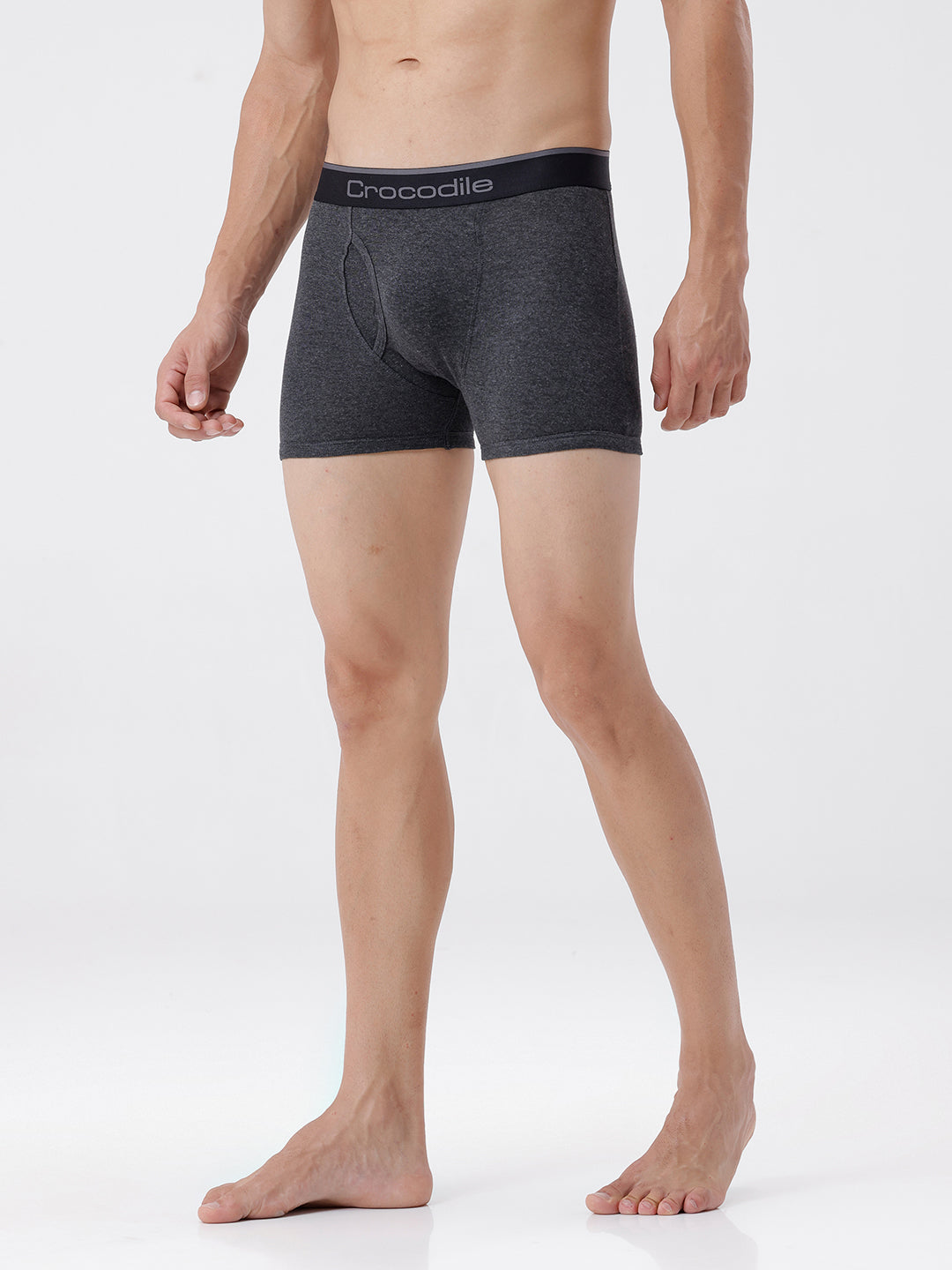 Person wearing gray boxer briefs with a visible brand logo on a white background