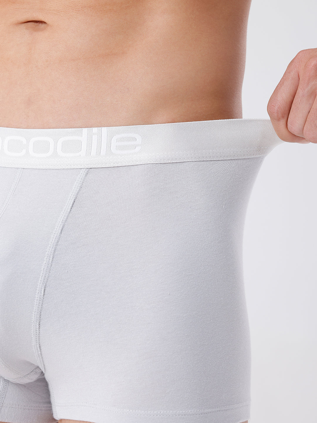 White boxer briefs with a brand logo on a plain background