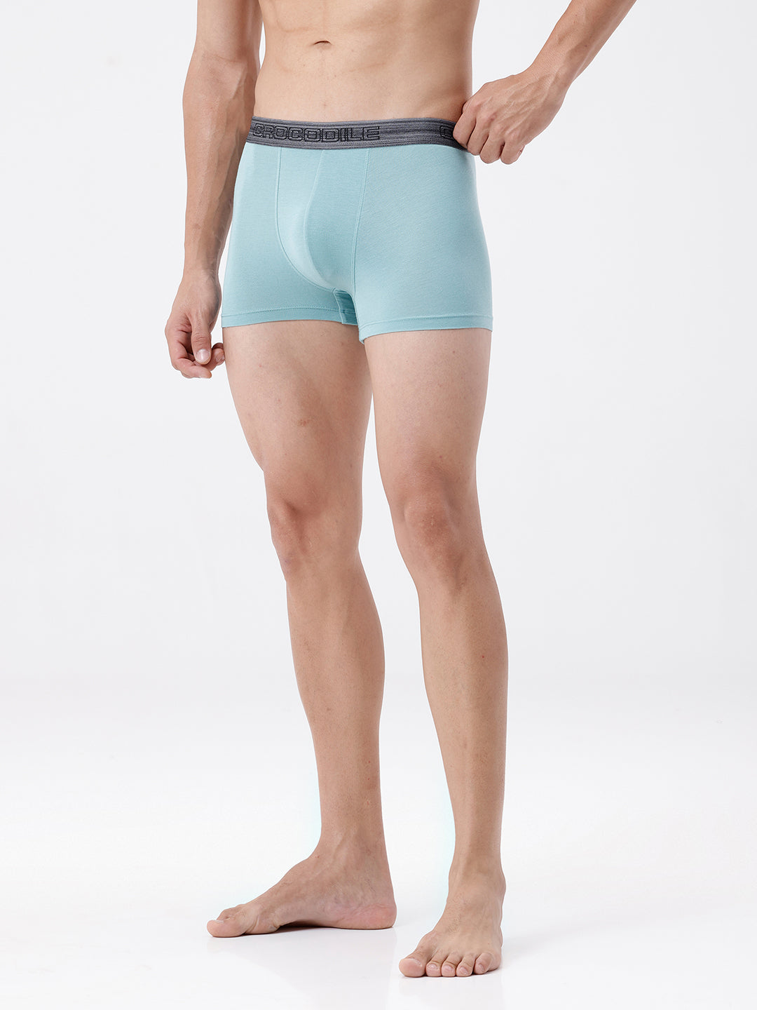 Man wearing light blue boxer briefs on a white background