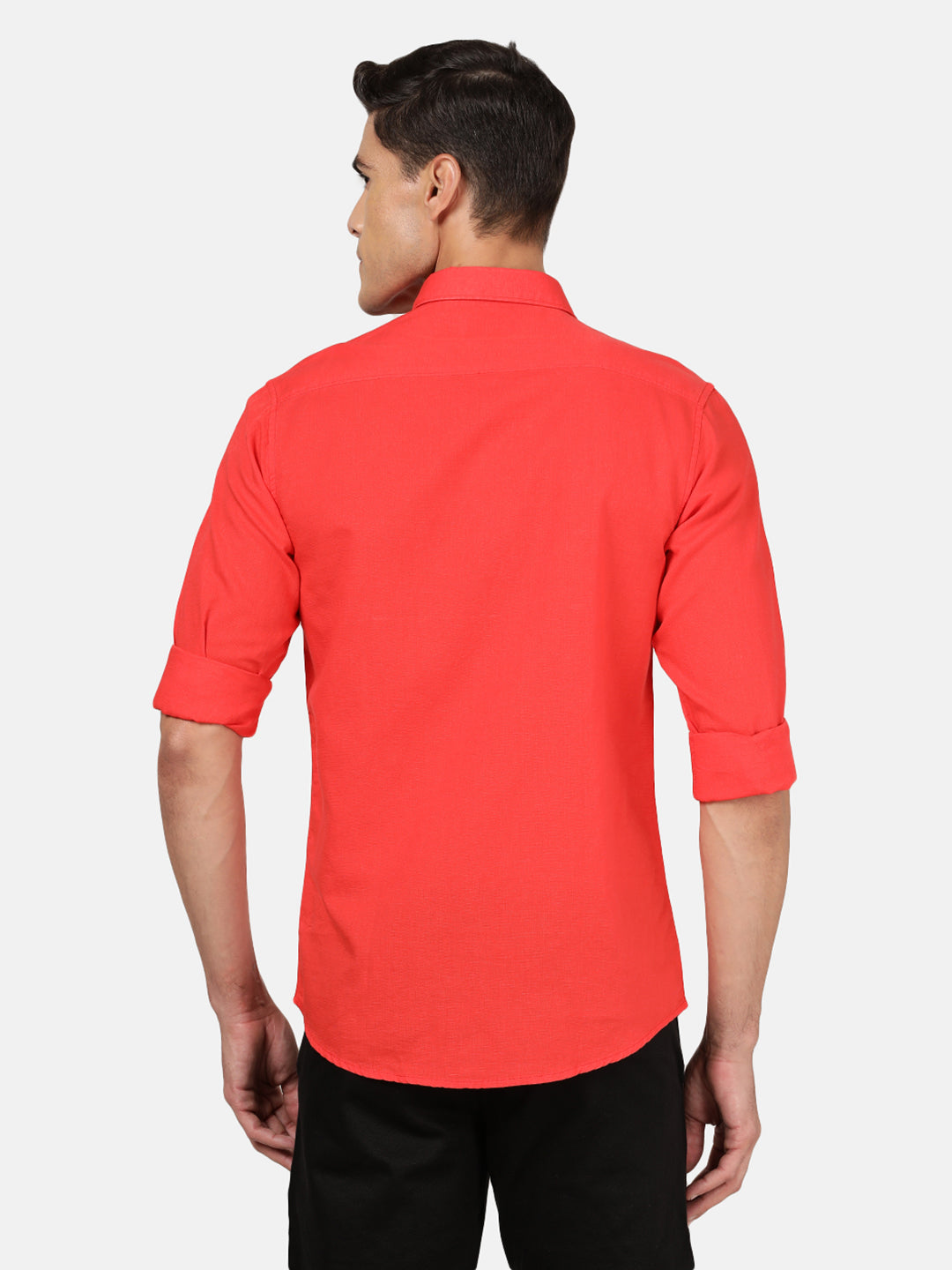 Man wearing a red red solid full sleeve linen shirt with casual styling on a gray background