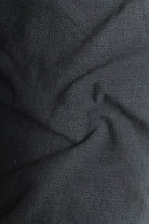 Close-up of dark gray fabric with visible texture