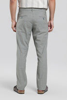 Person wearing gray pants on a white background