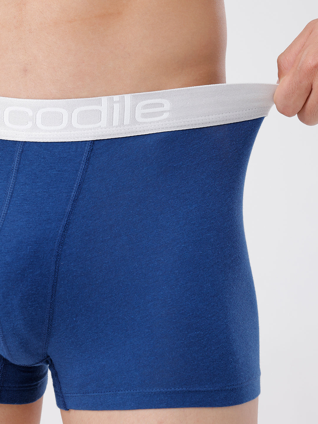 Blue boxer briefs with white waistband featuring 'coolibar' brand on a neutral background