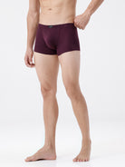 Man wearing purple underwear on a white background