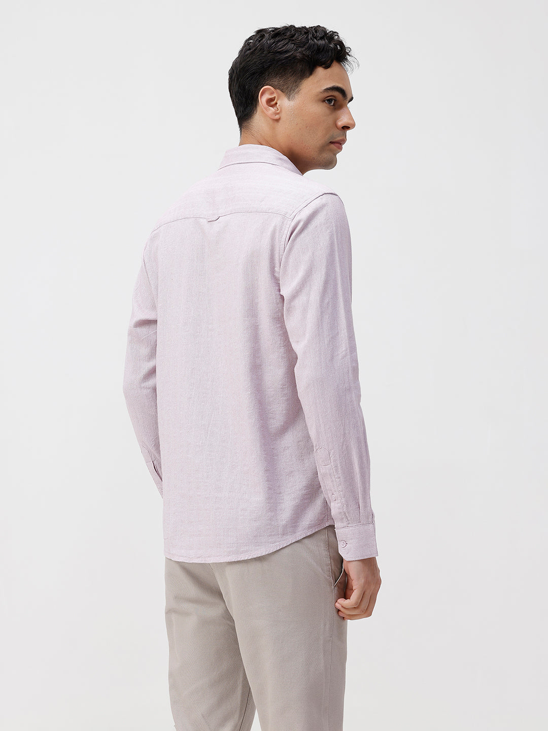 Man wearing a red rib textured cotton shirt light purple on a light gray background