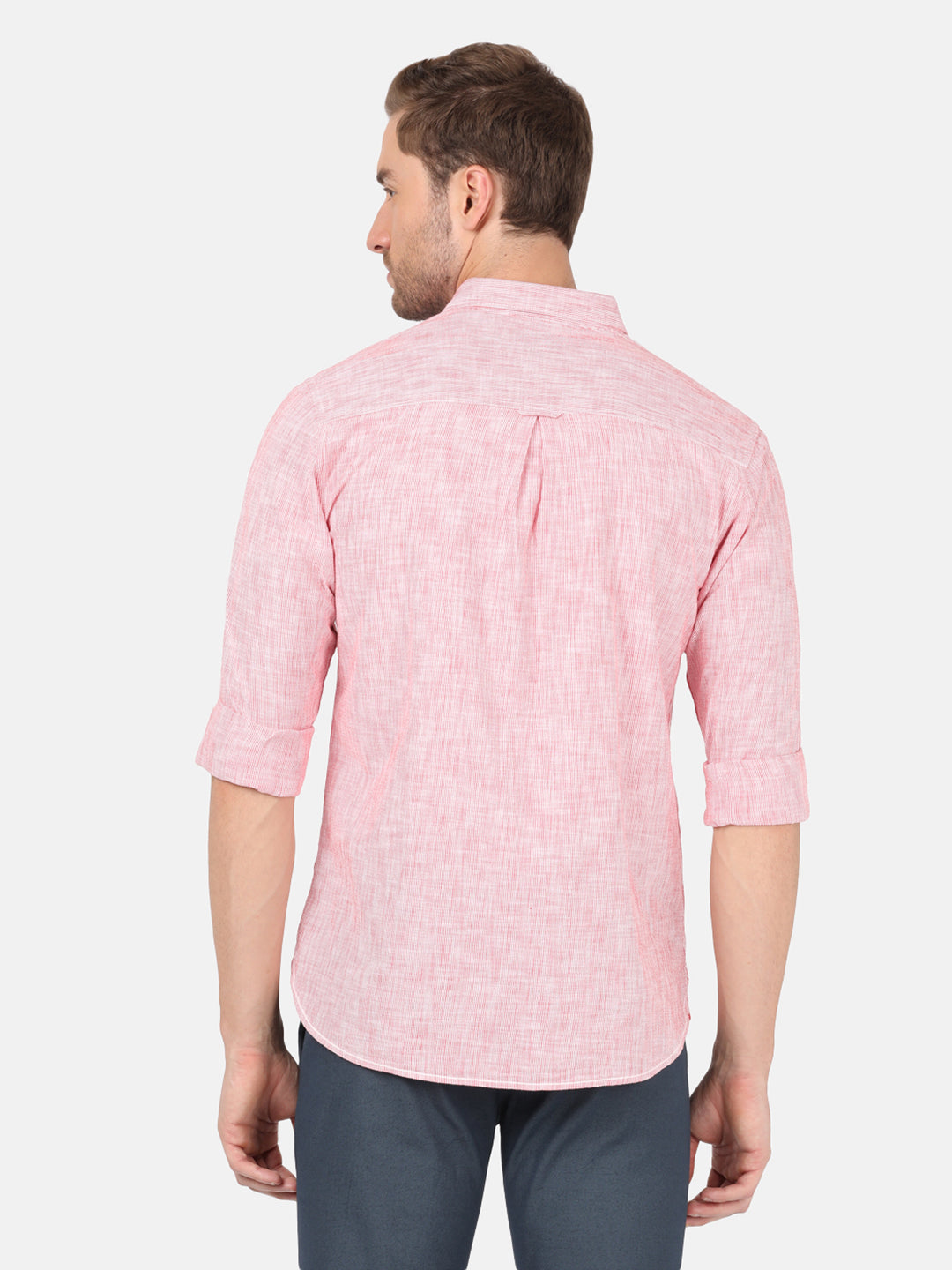 Man wearing a red red striped casual full sleeve 100% cotton shirt on a light gray background