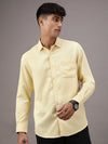 Man wearing a yellow yellow solid full sleeve 100% cotton shirt with casual styling on a gray background