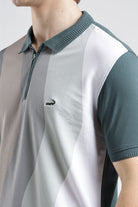 Color-blocked polo shirt with a brand logo on a neutral background