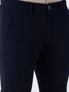 Man wearing a red textured essential chinos navy with casual styling on a gray background