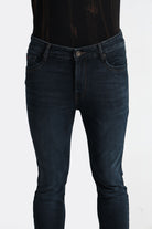 Dark blue jeans on a white background