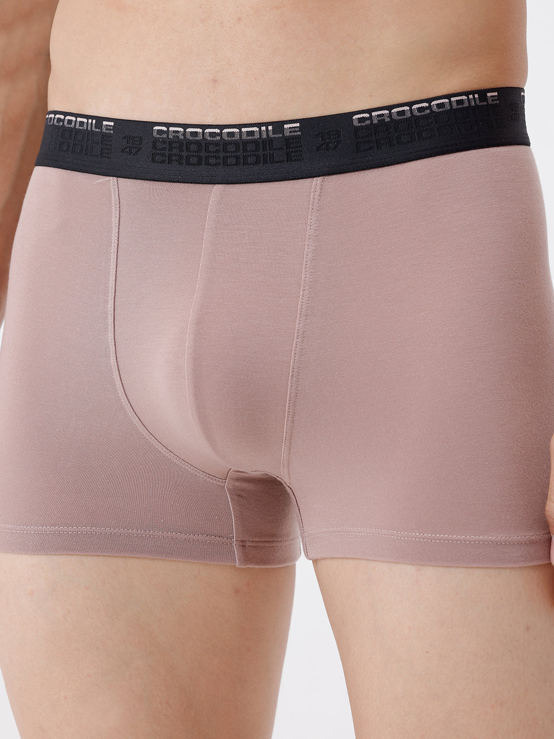 Pink boxer briefs with black waistband featuring 'Crocodile' branding on a neutral background.