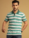 Man wearing a white green and white striped polo t shirt on a light gray background