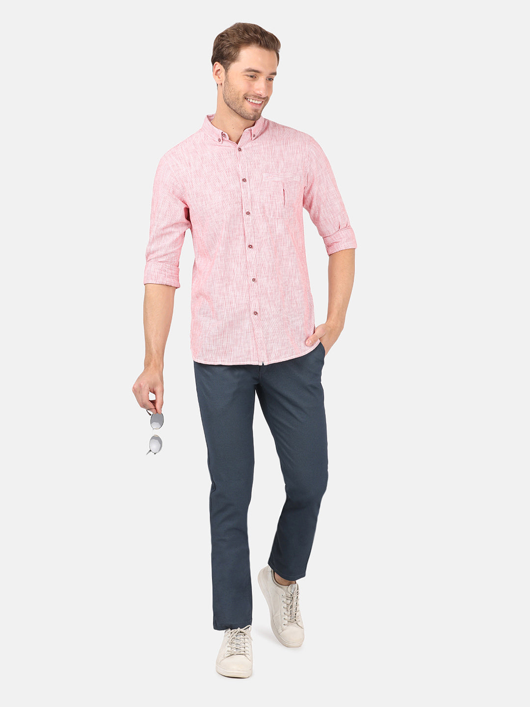 Man wearing a red red striped casual full sleeve 100% cotton shirt on a light gray background