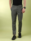 Man wearing a green solid casual olive green slim fit trouser with casual styling on a gray background