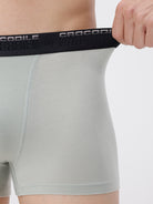 Gray athletic shorts with black waistband featuring 'Crocodile' branding.