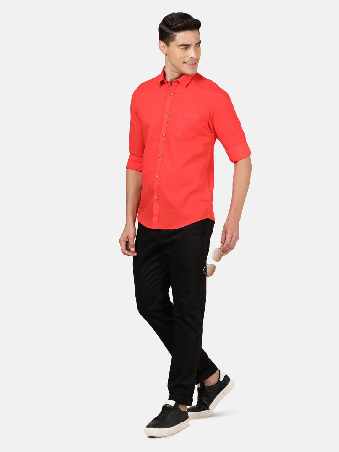 Man wearing a red red solid full sleeve linen shirt with casual styling on a gray background