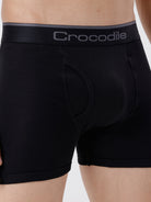 Black boxer briefs with a visible brand logo on a white background