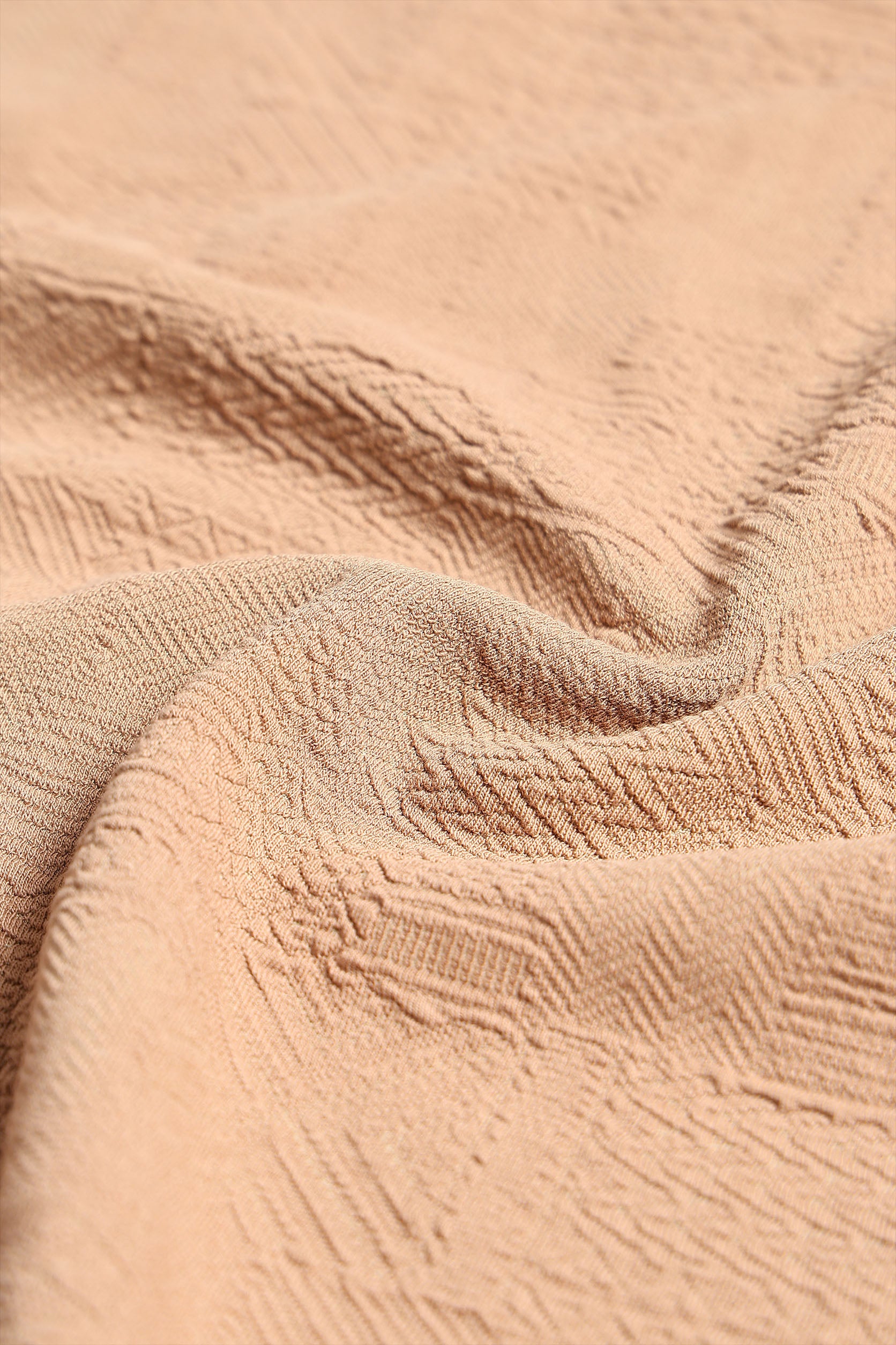 Close-up of textured beige fabric