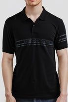 Black polo shirt with 'Crocodile' branding on a white background