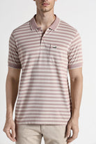 Man wearing a striped polo shirt on a white background
