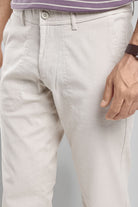 Close-up of light-colored pants with a blurred background