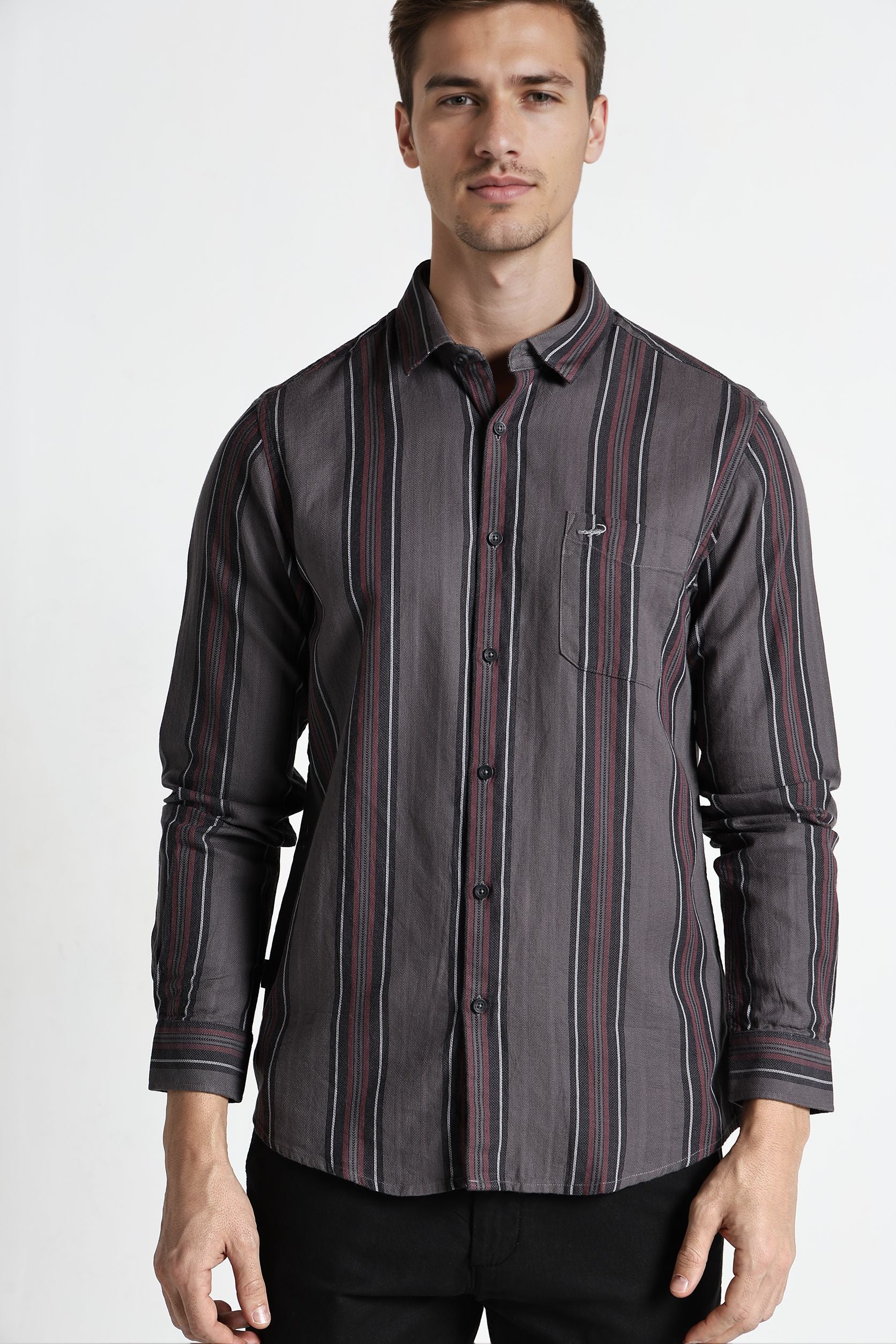 Man wearing a gray striped shirt on a white background