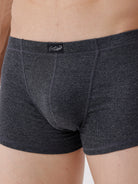 Dark gray boxer briefs with a brand logo on a neutral background