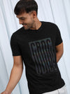 Man wearing a brown brown casual printed t shirt with casual styling on a gray background