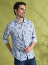 Man wearing a grey linen blend abstract dry leaf print shirt grey with casual styling on a gray background