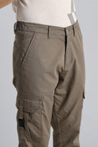 Brown cargo pants on a plain background
