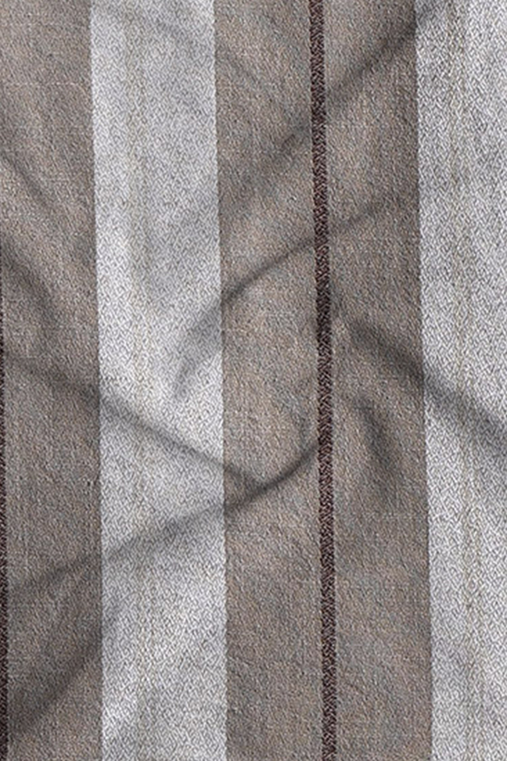 Close-up of fabric with horizontal striped pattern in gray and brown tones.