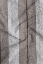 Close-up of fabric with horizontal striped pattern in gray and brown tones.