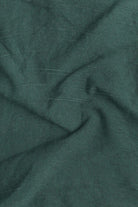 Close-up of green fabric with subtle texture
