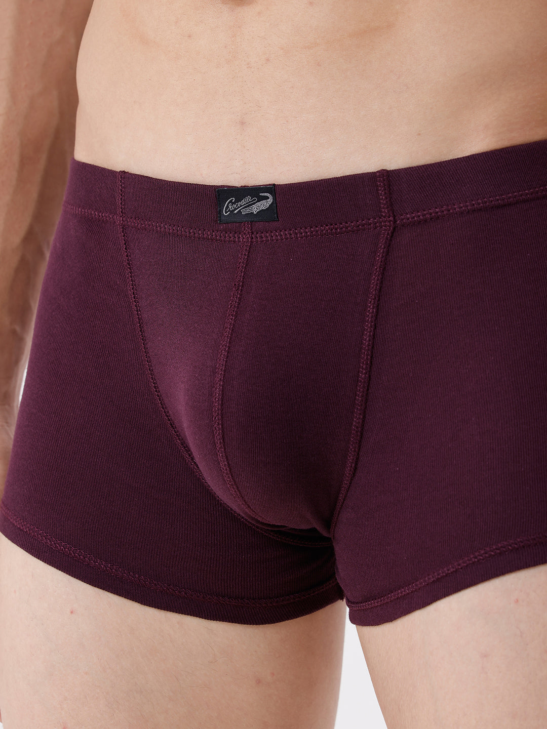 Maroon boxer briefs with a brand logo on a neutral background