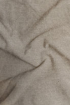 Close-up of beige fabric with visible texture