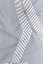 Close-up of gray fabric with white geometric pattern