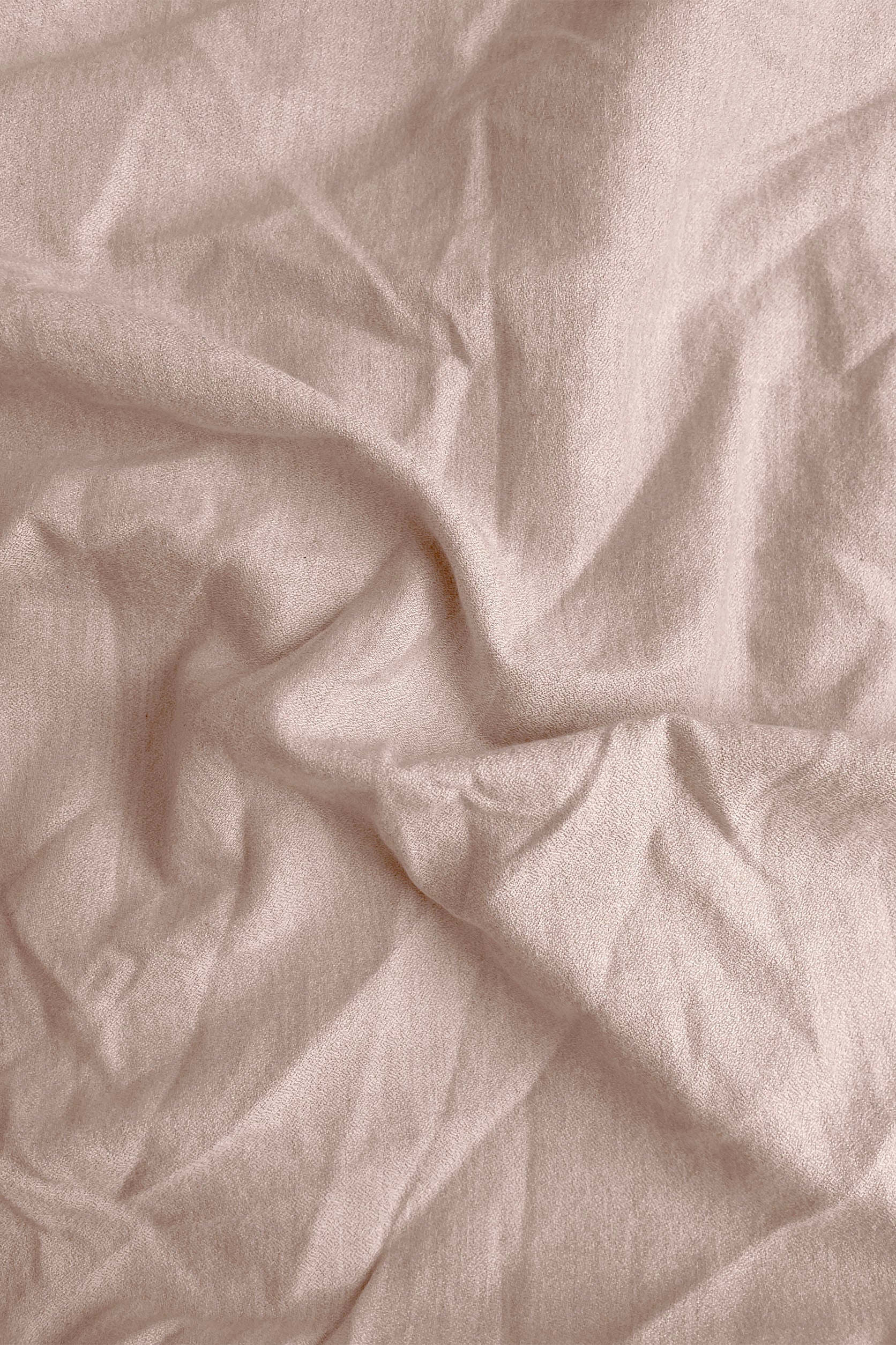 Close-up of crumpled beige fabric