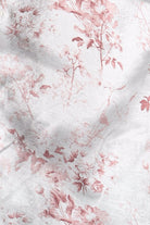 Floral patterned fabric with pink flowers on a white background