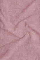 Close-up of pink fabric with a textured pattern