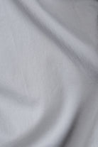 Close-up of gray fabric with a subtle pattern