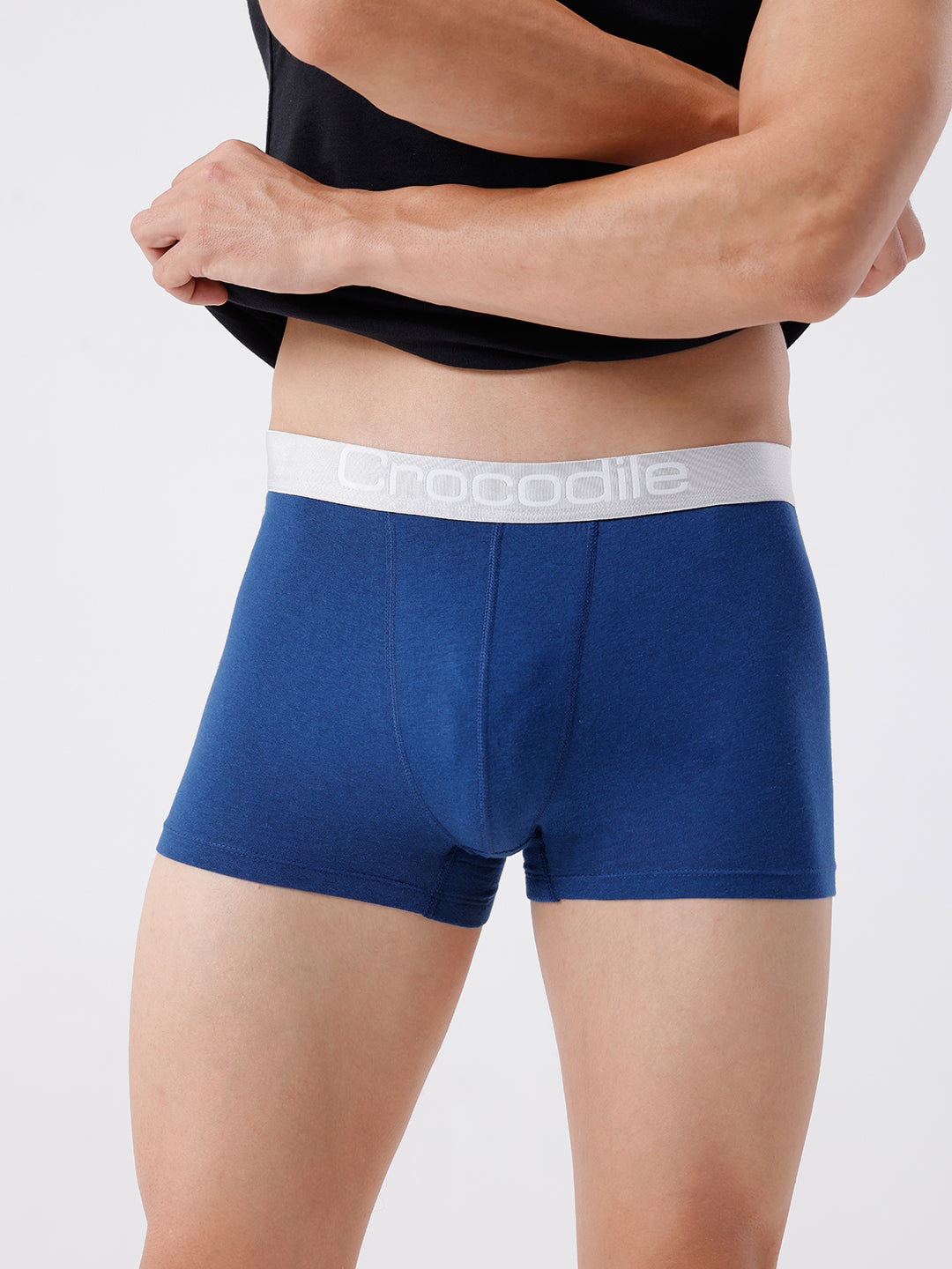 Blue boxer briefs with a white waistband featuring a brand logo on a plain background