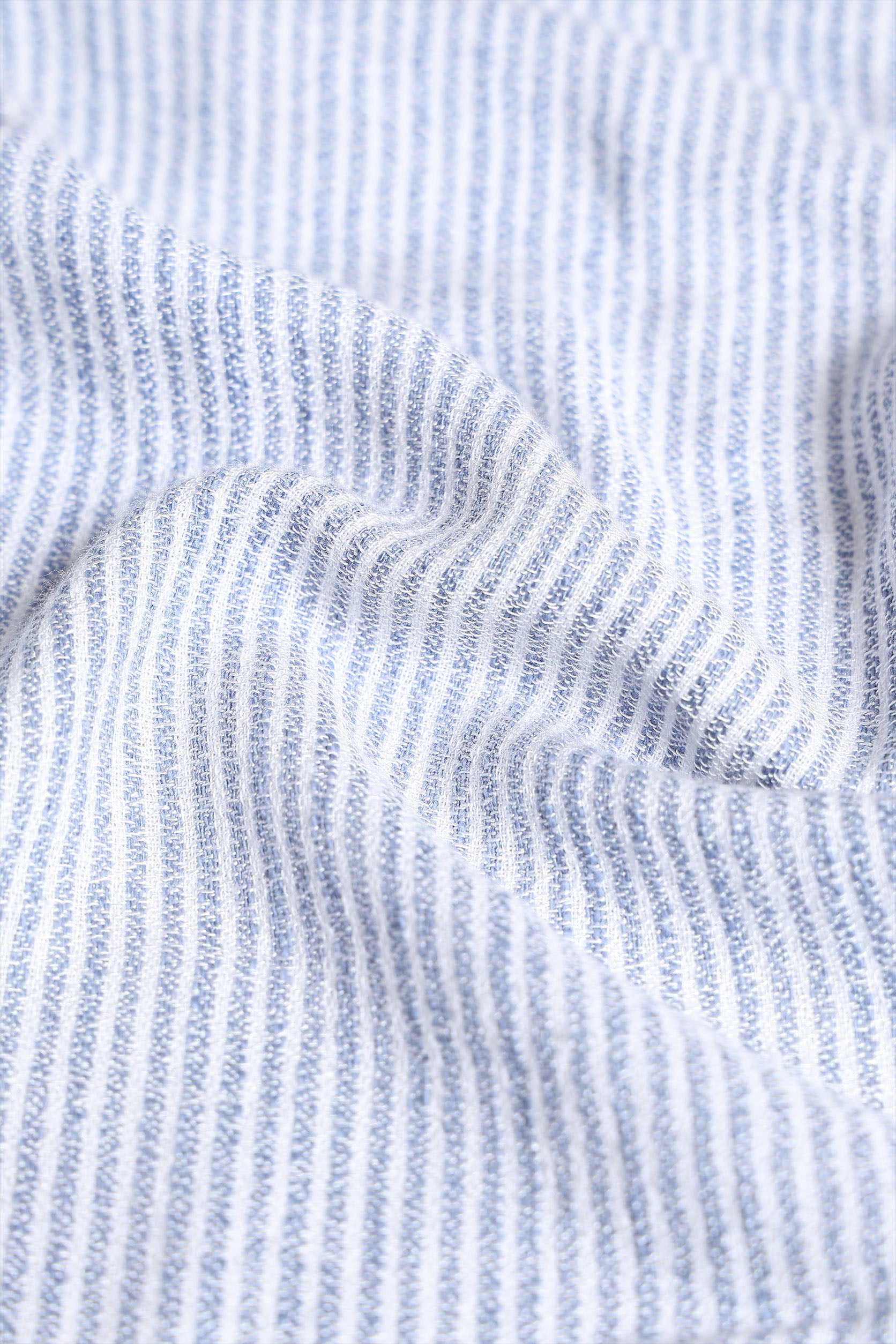 Close-up of blue and white striped fabric texture