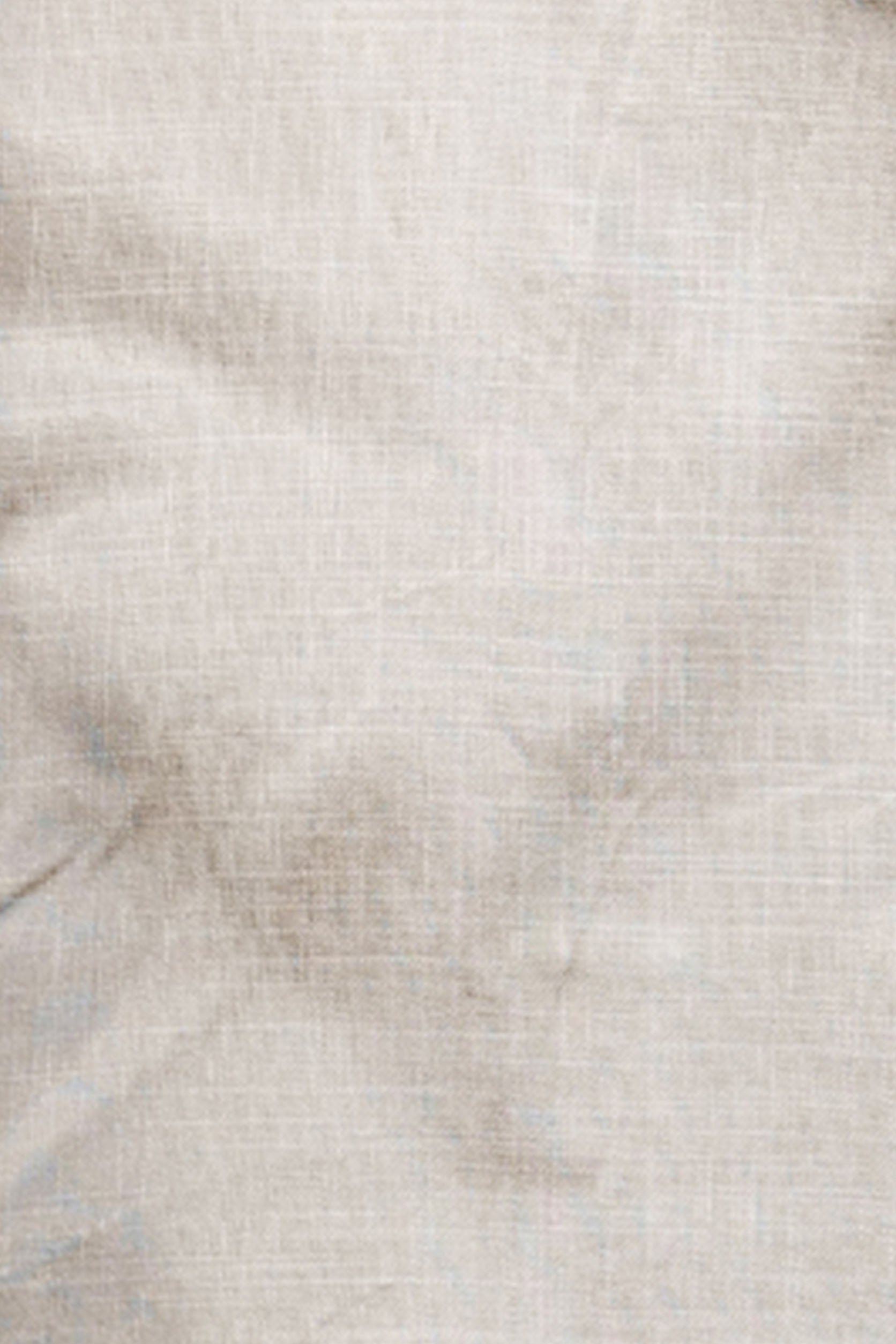 Close-up of a textured beige fabric surface