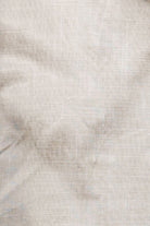 Close-up of a textured beige fabric surface