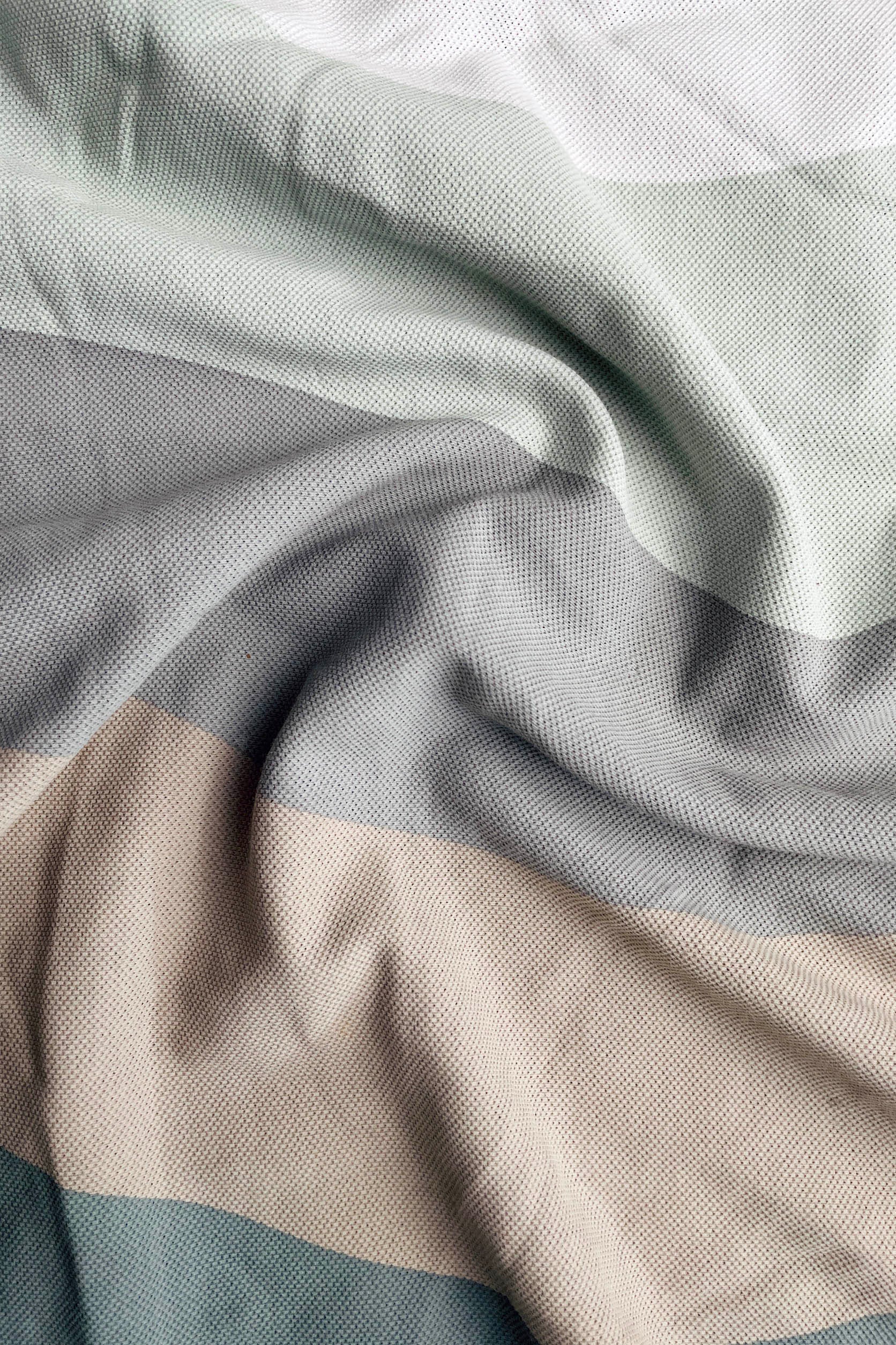 Close-up of fabric with gray and beige stripes