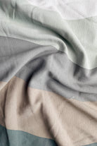 Close-up of fabric with gray and beige stripes