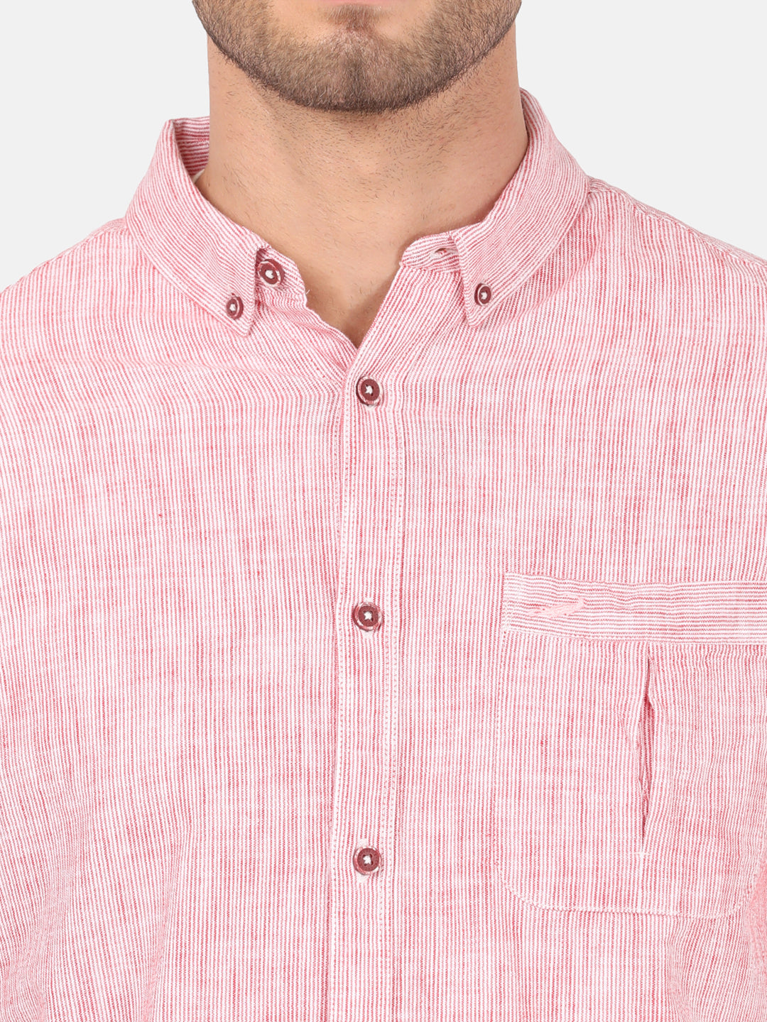 Man wearing a red red striped casual full sleeve 100% cotton shirt on a light gray background