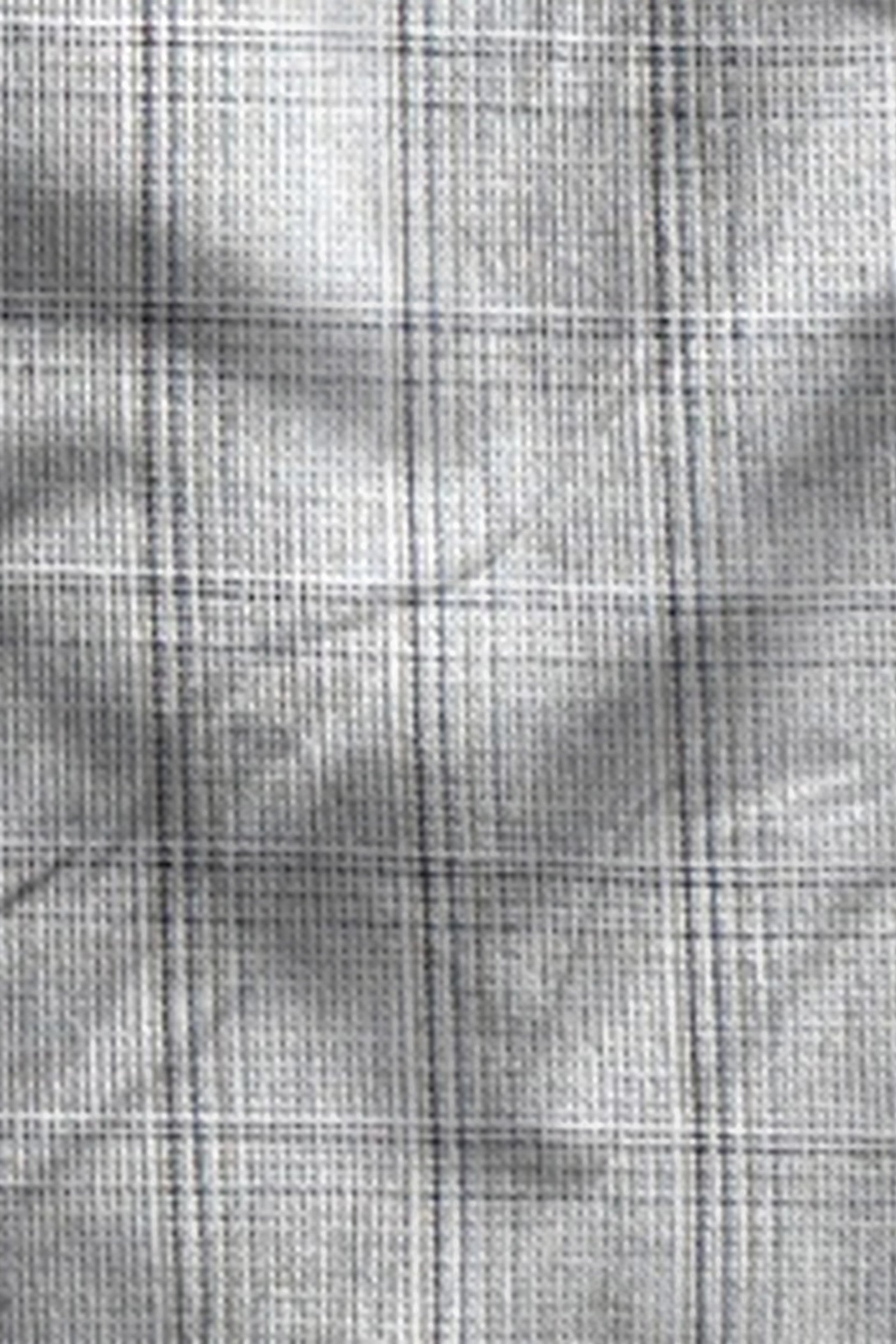 Close-up of a textured fabric with a grid pattern
